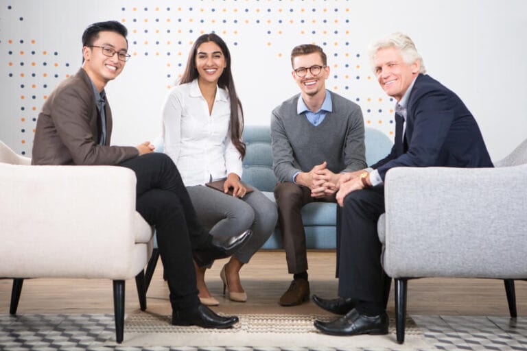 Colleagues discussing a corporate structure plan in a meeting room